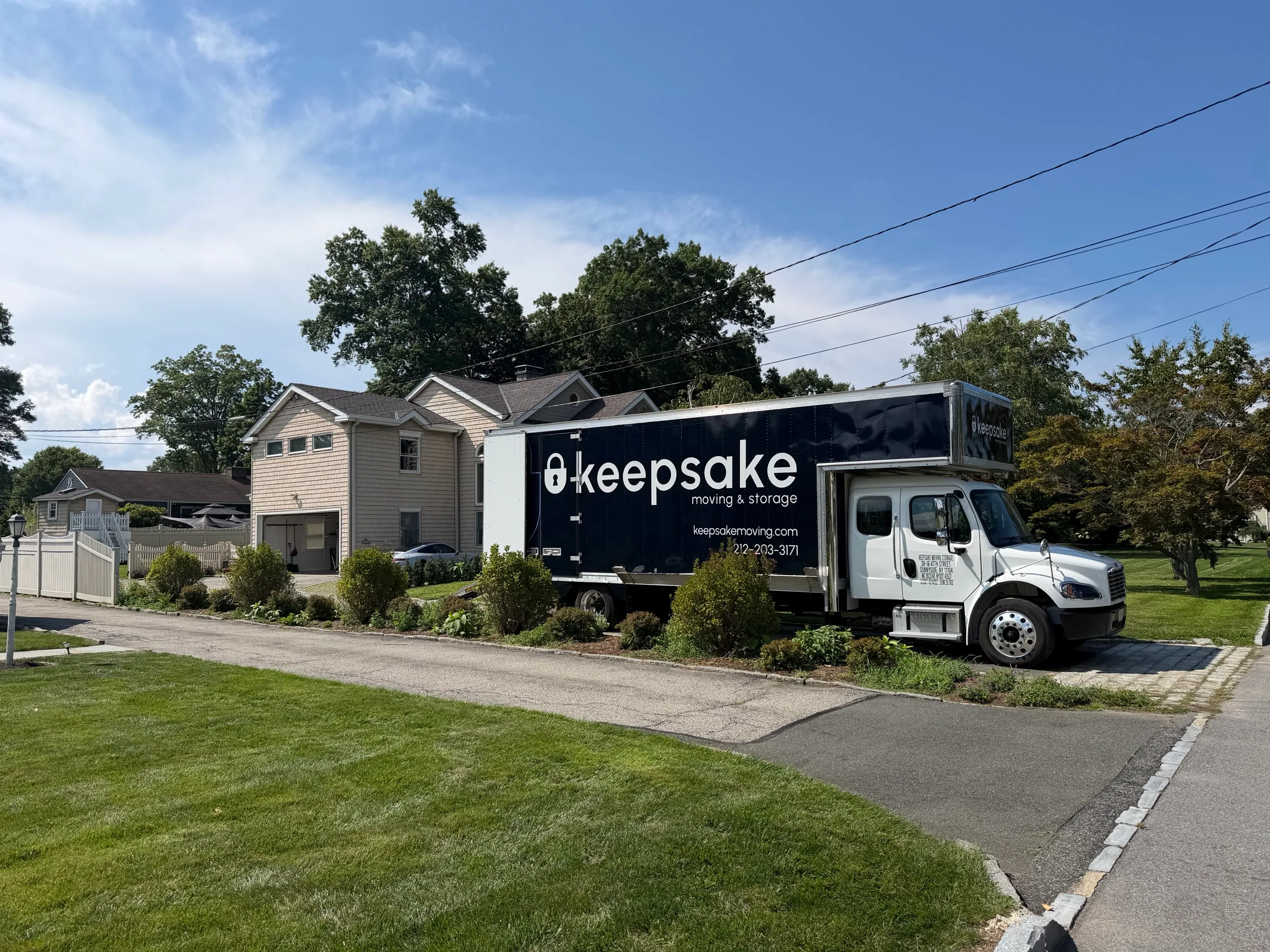 Keepsake truck livery mockup outside a two-story house